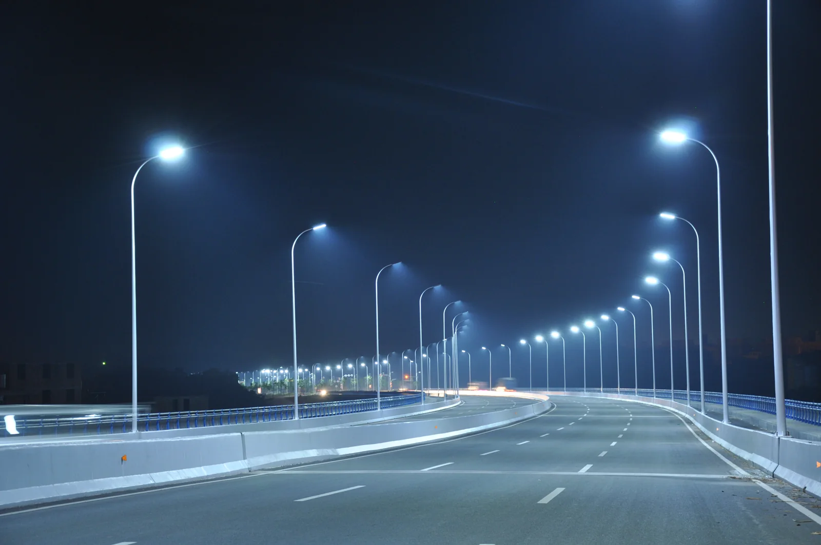 LED street lights along a divided road at night