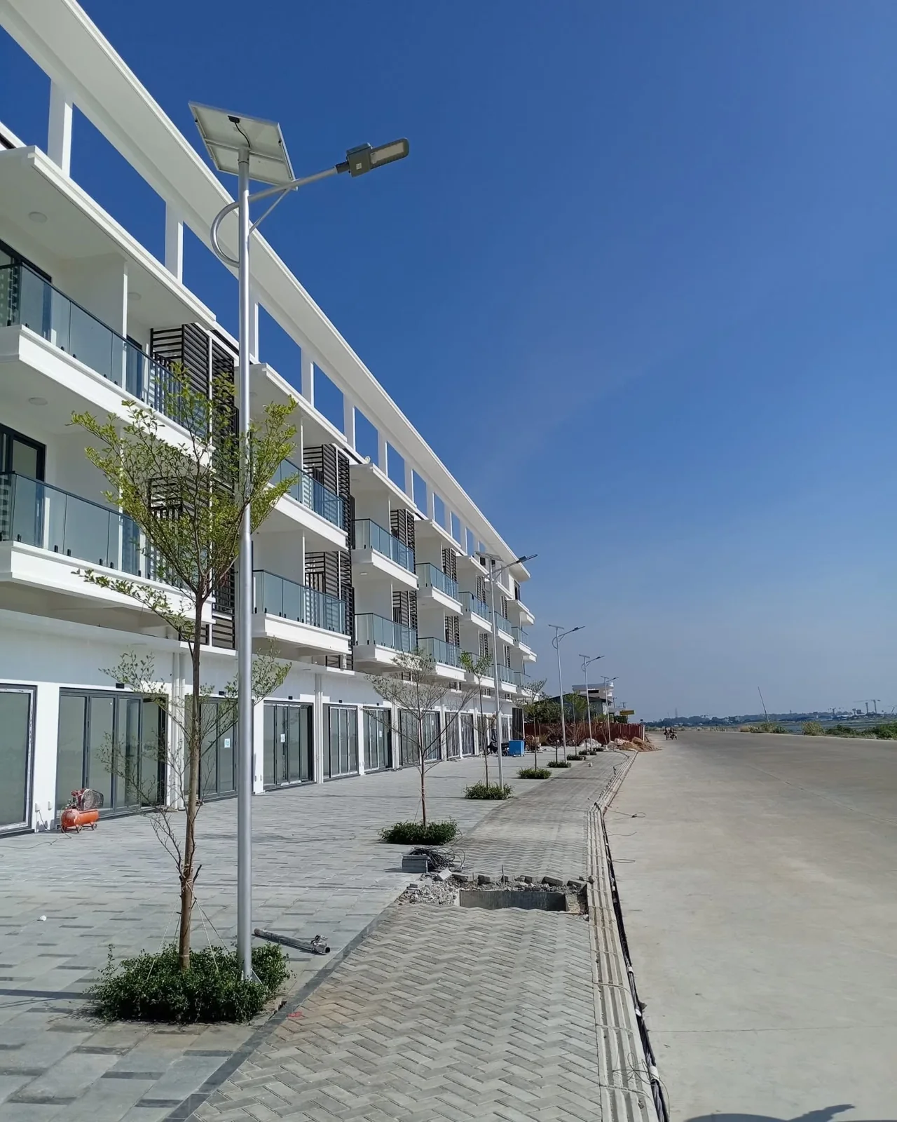 Solar street lights beside a building