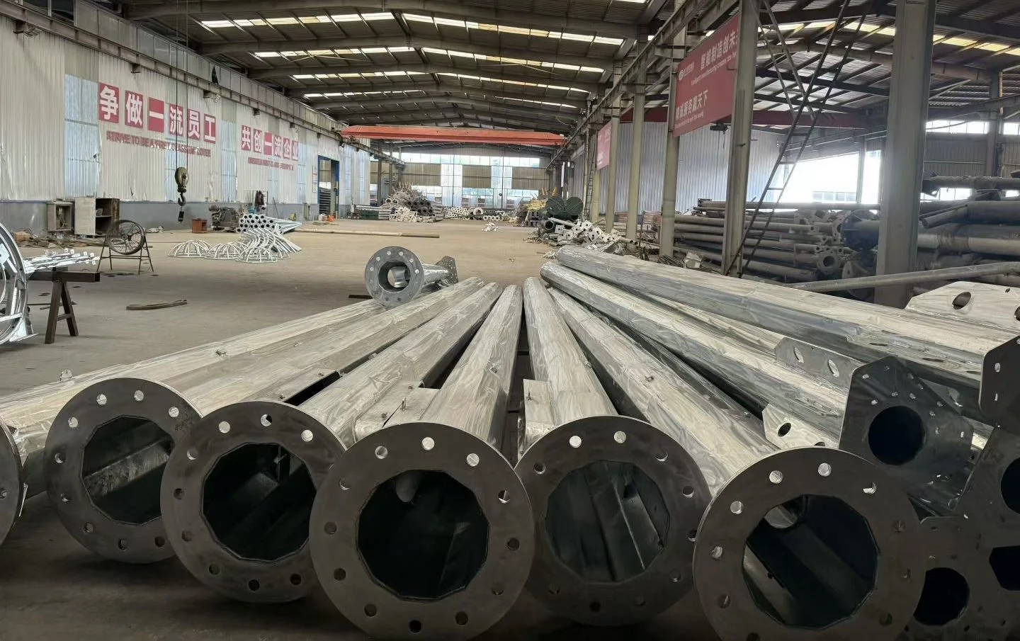 Steel pole sections and bolted flanges